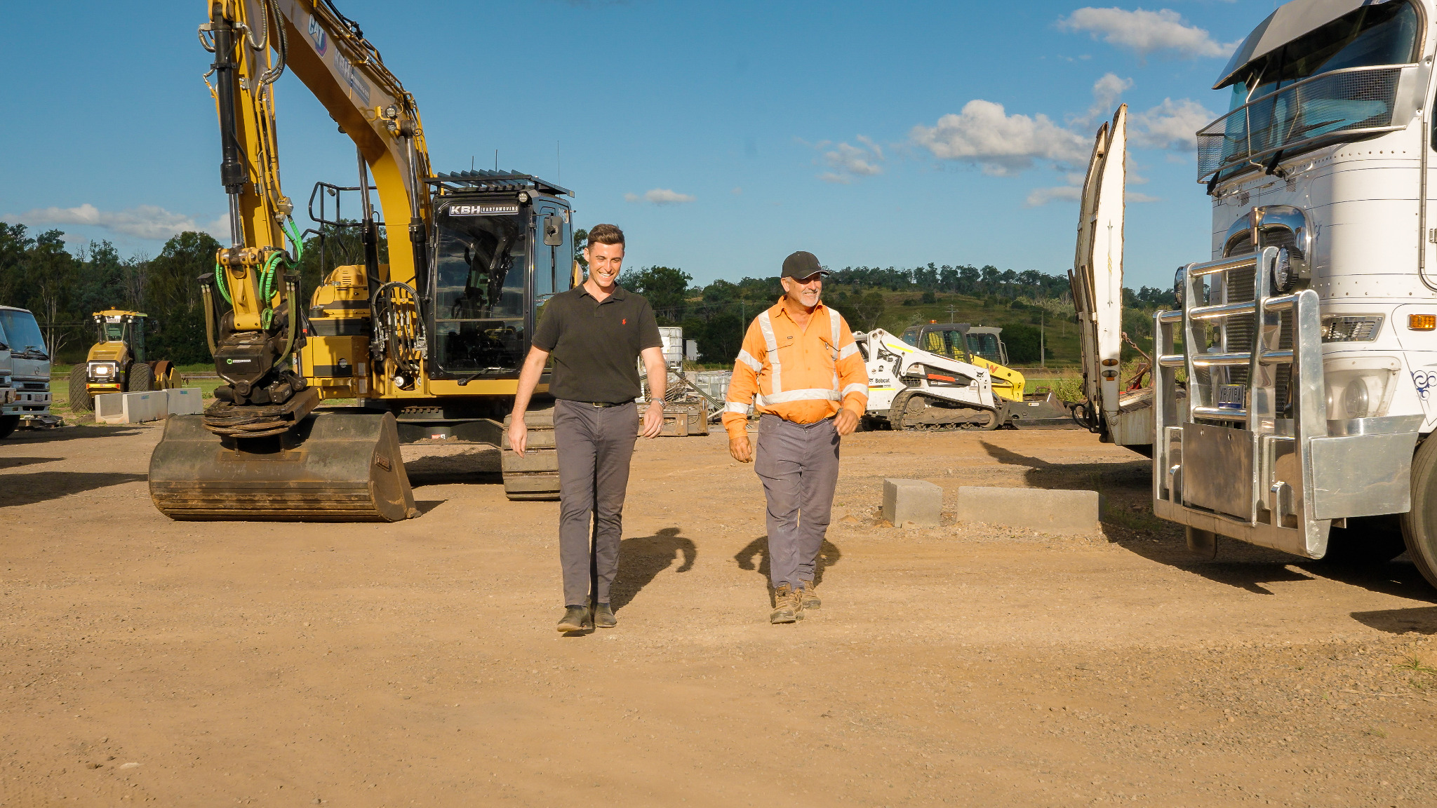 James Allan walking with Anthony Goetsch at the KBH Earthmoving yard in Kalbar, South East Queensland